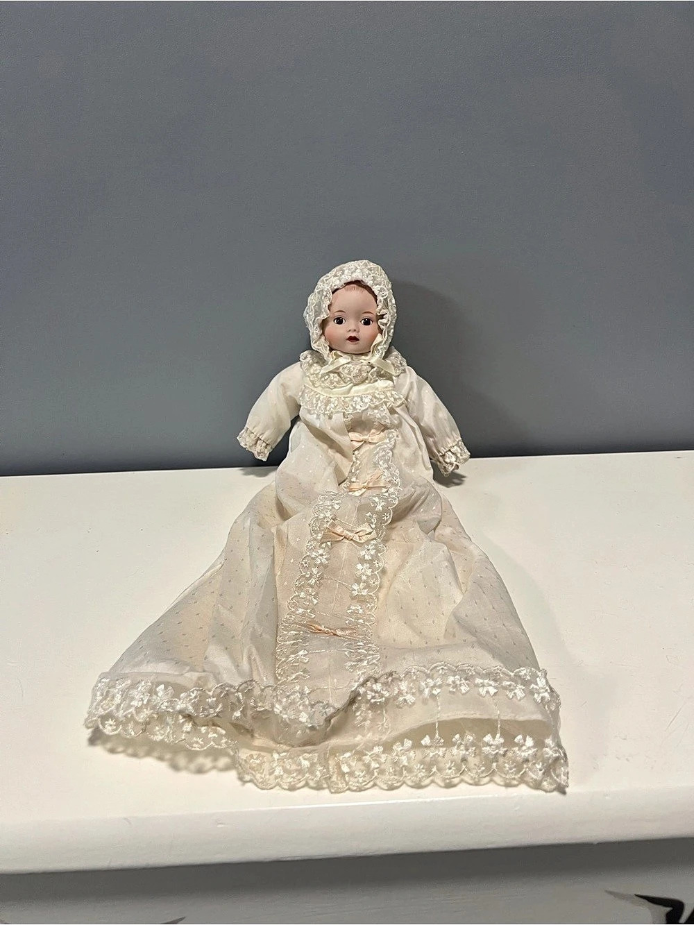 Porcelain baby doll in Christening dress Doll in off white